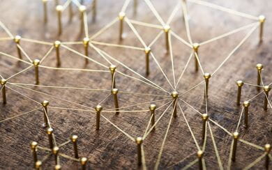 Web of gold wires on rustic wood